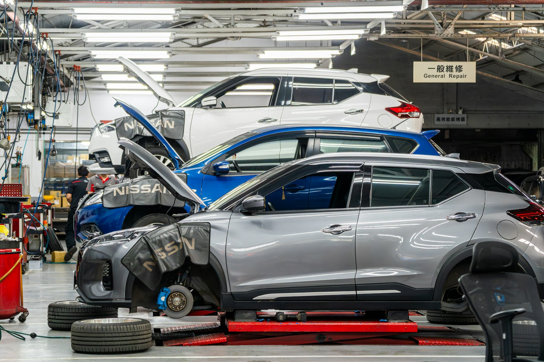 Vehicles in a collision repair shop